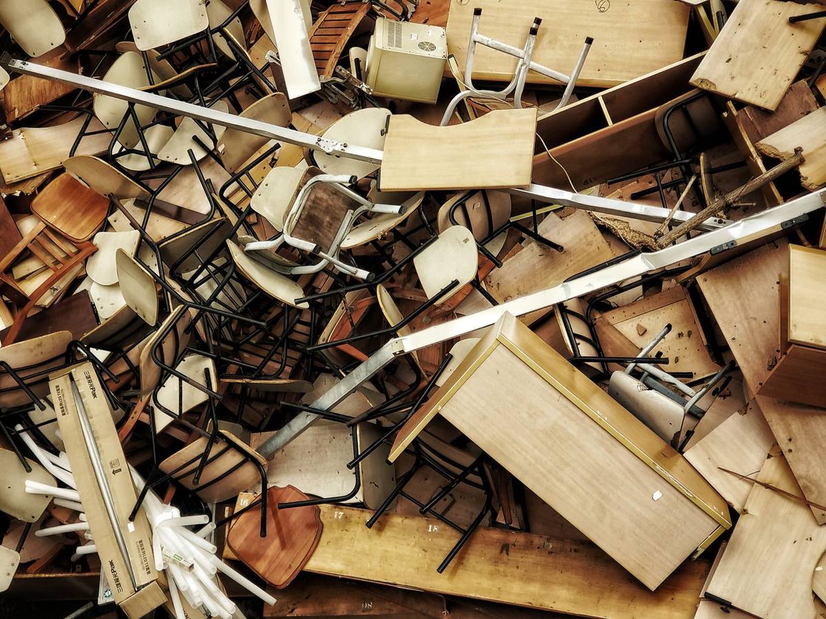 Junk removal crew loading old furniture during a Calgary move, Western Provincial Movers, Calgary AB