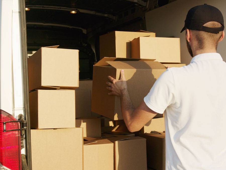 Western Provincial Movers crew wrapping furniture for a short-notice Calgary move, Calgary AB