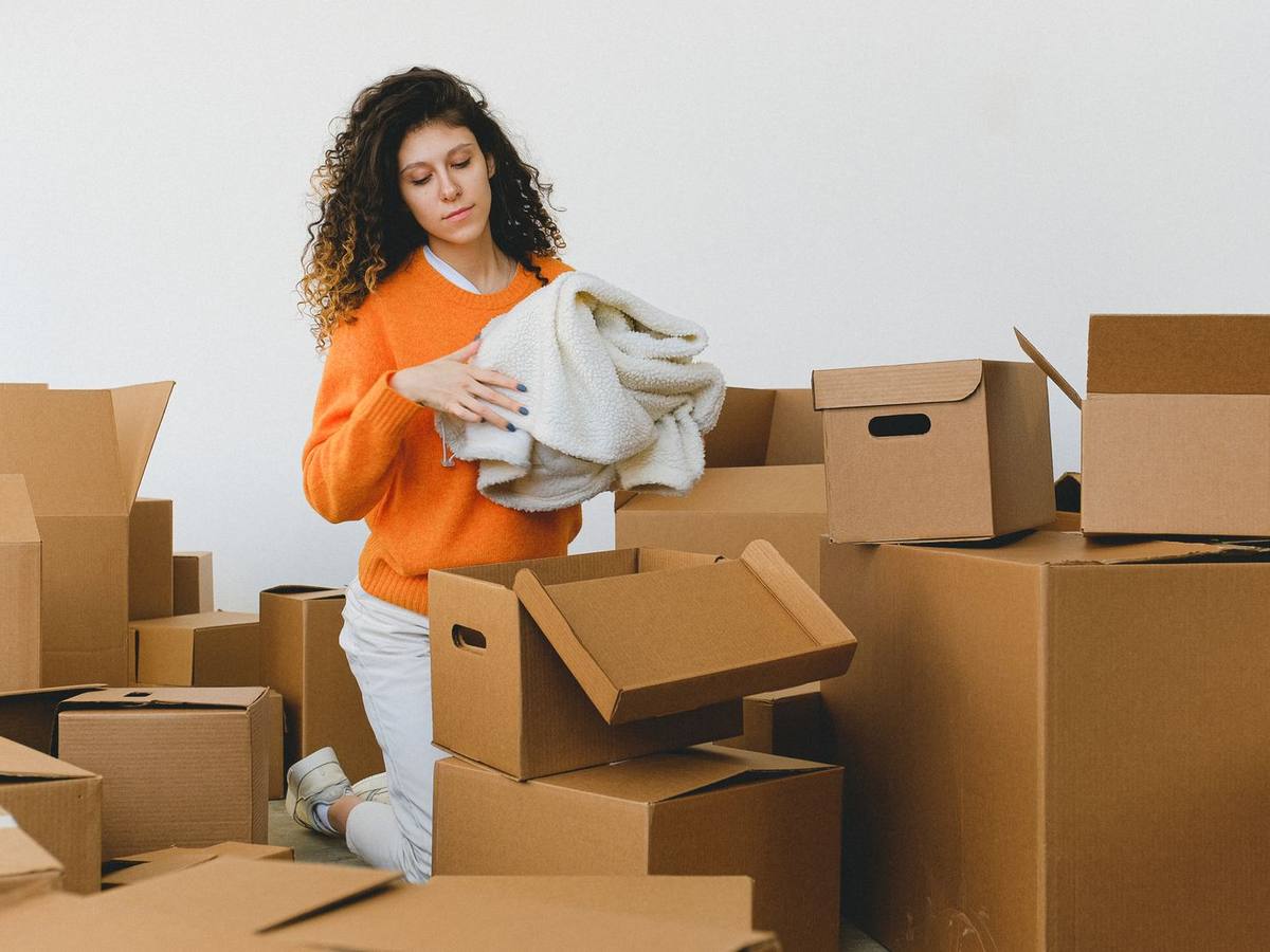 Student movers carrying boxes into a Calgary campus apartment, Western Provincial Movers, Calgary AB