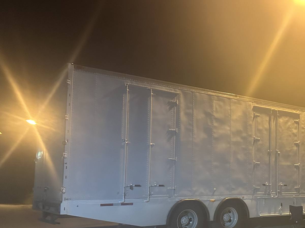 Western Provincial Movers moving trailer parked under a streetlight at night on a long-distance run