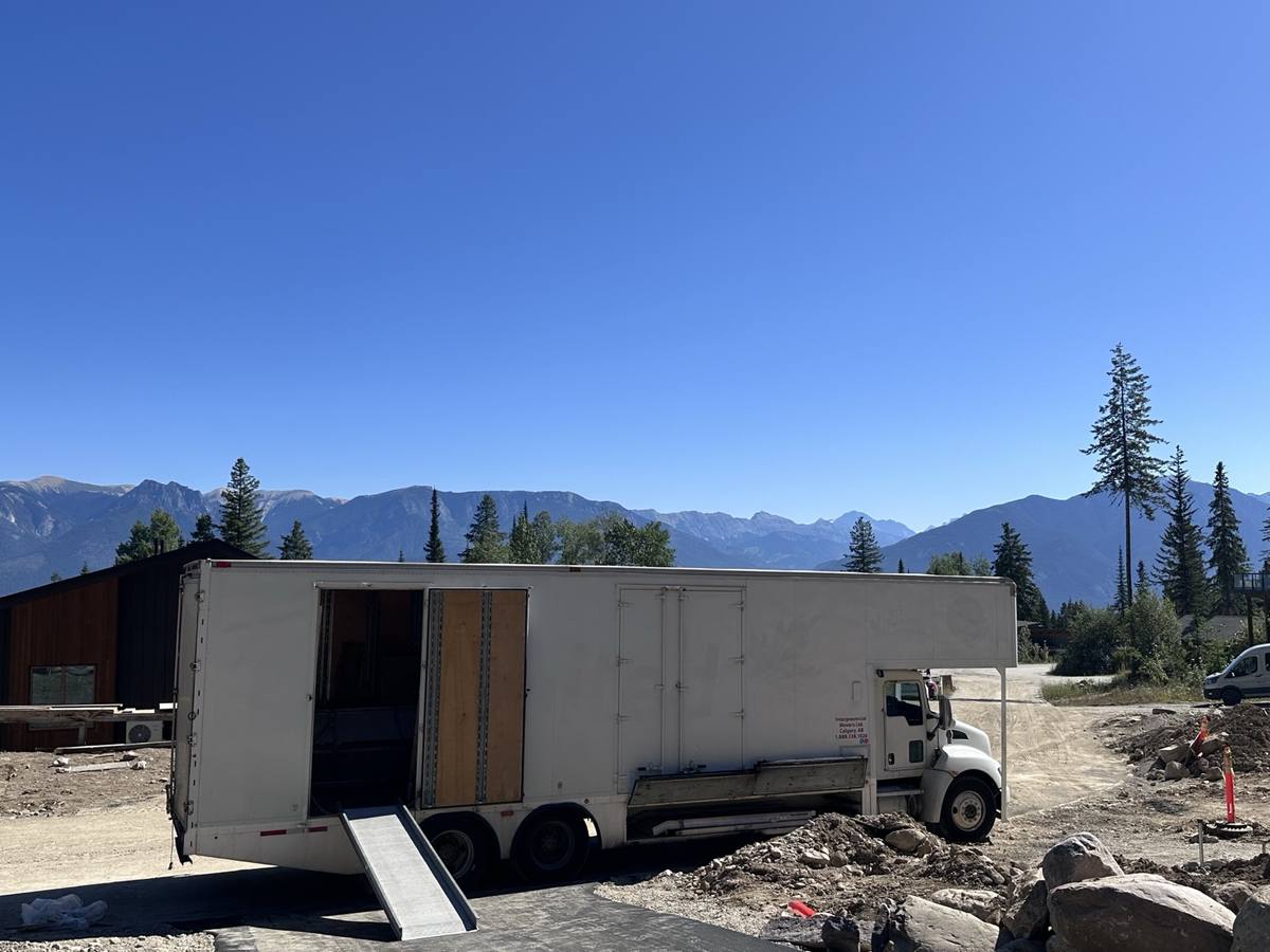 Vancouver to Calgary movers, Western Provincial Movers truck with the walk ramp down at a mountain home